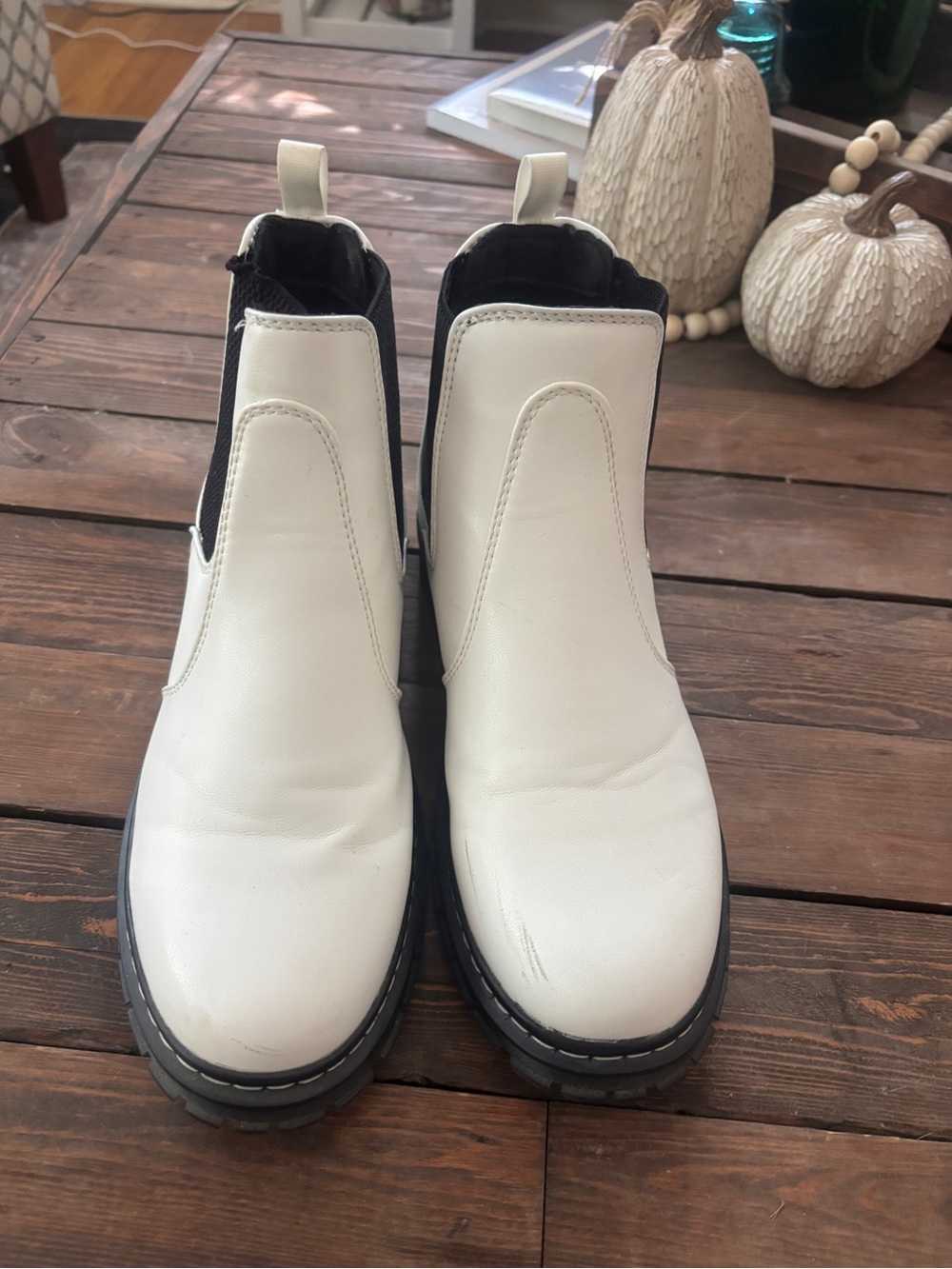 Women’s white slip on boots.